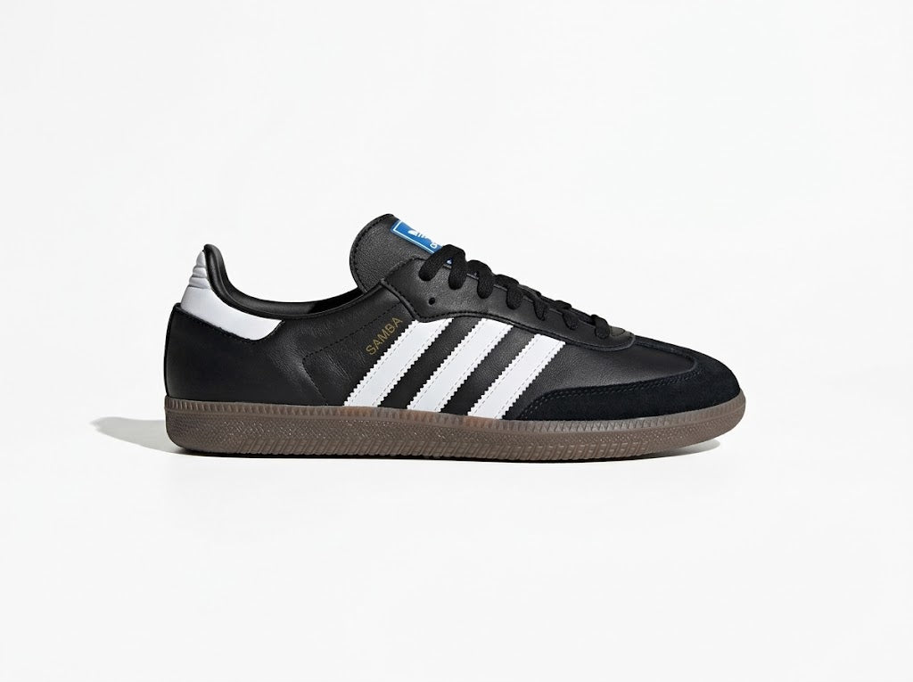 Black low-top sneaker, side view on white background
